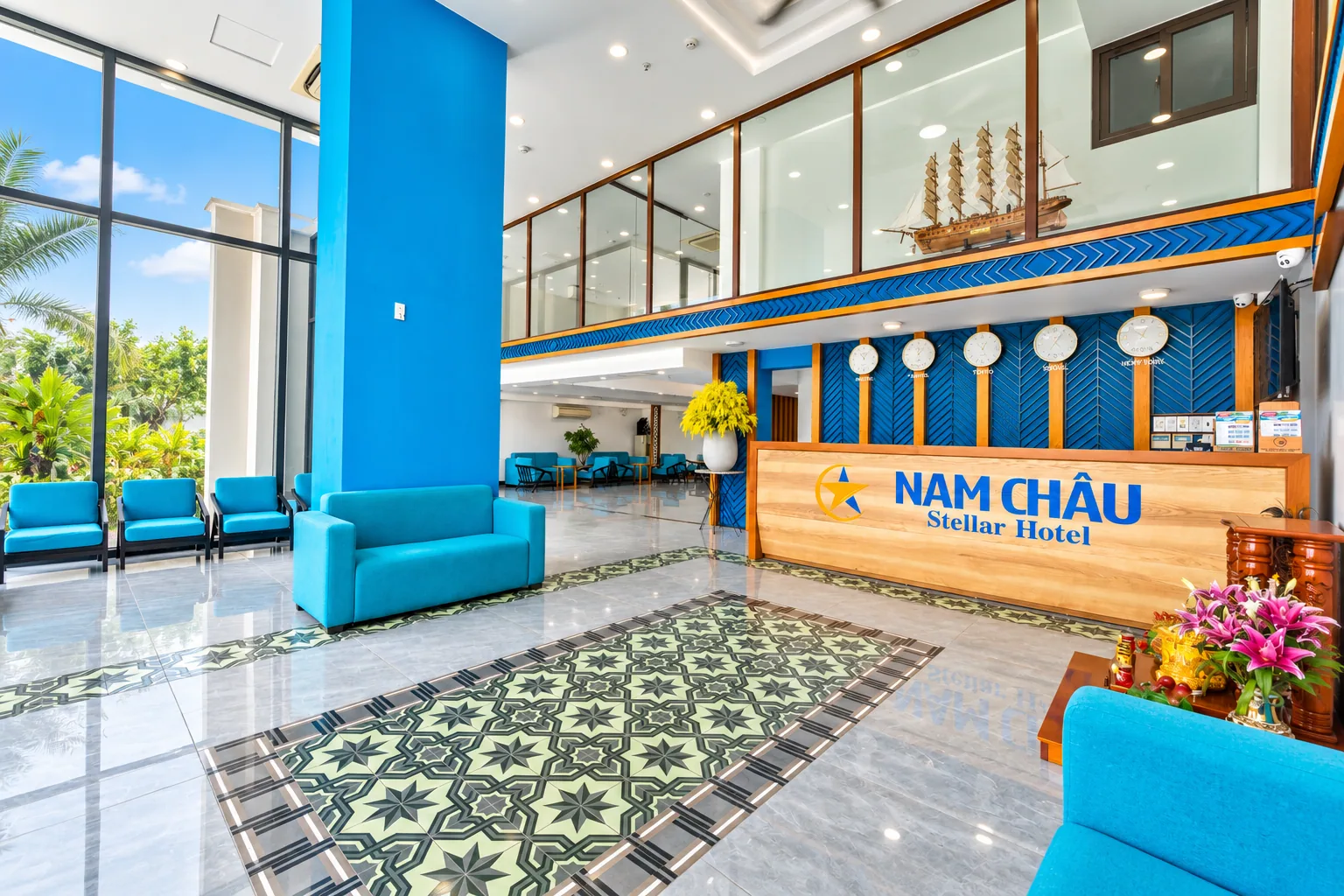 Nam Chau Stellar reception desk with blue seating in the bright entrance lobby